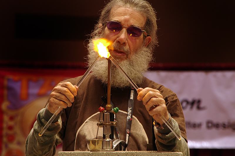 Man working glass with a flame