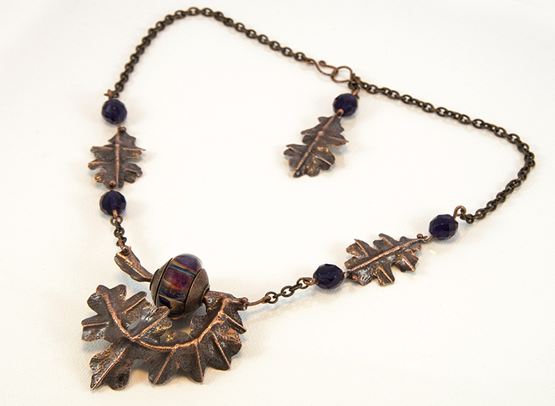 Copper leaf necklace with purple beads